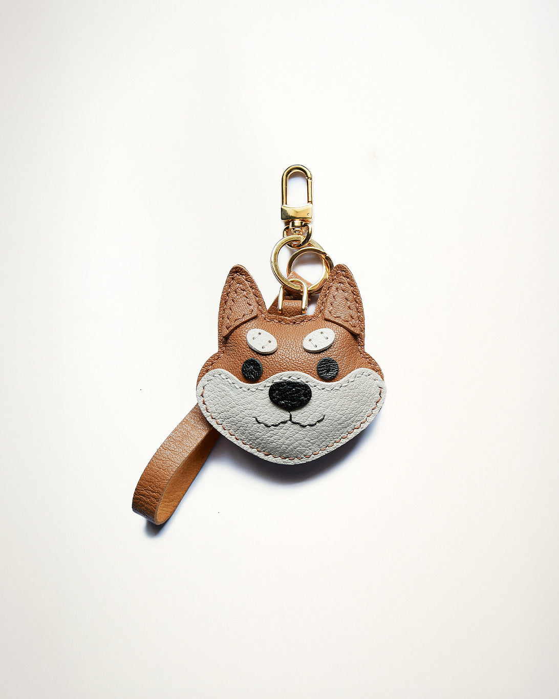Mochi Manner handmade full-grain sheep leather Shiba Inu bag charm in tan and grey with gold-plated hardware