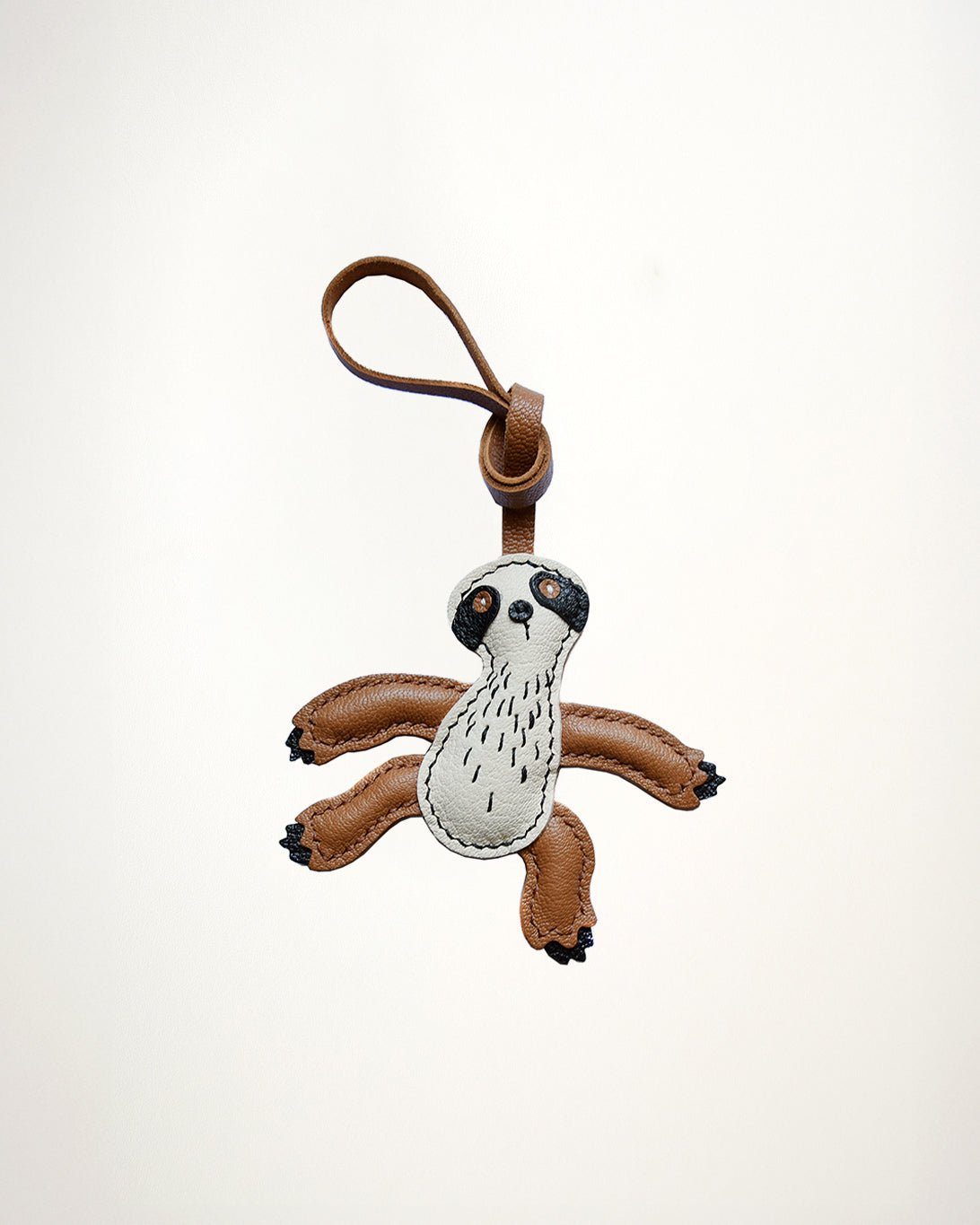Mochi Manner handmade full-grain leather – sheep skin sloth bag charm in brown and cream with gold-plated hardware
