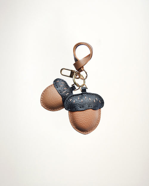 Mochi Manner handmade full-grain leather – sheep skin acorn bag charm in brown and black with gold-plated hardware