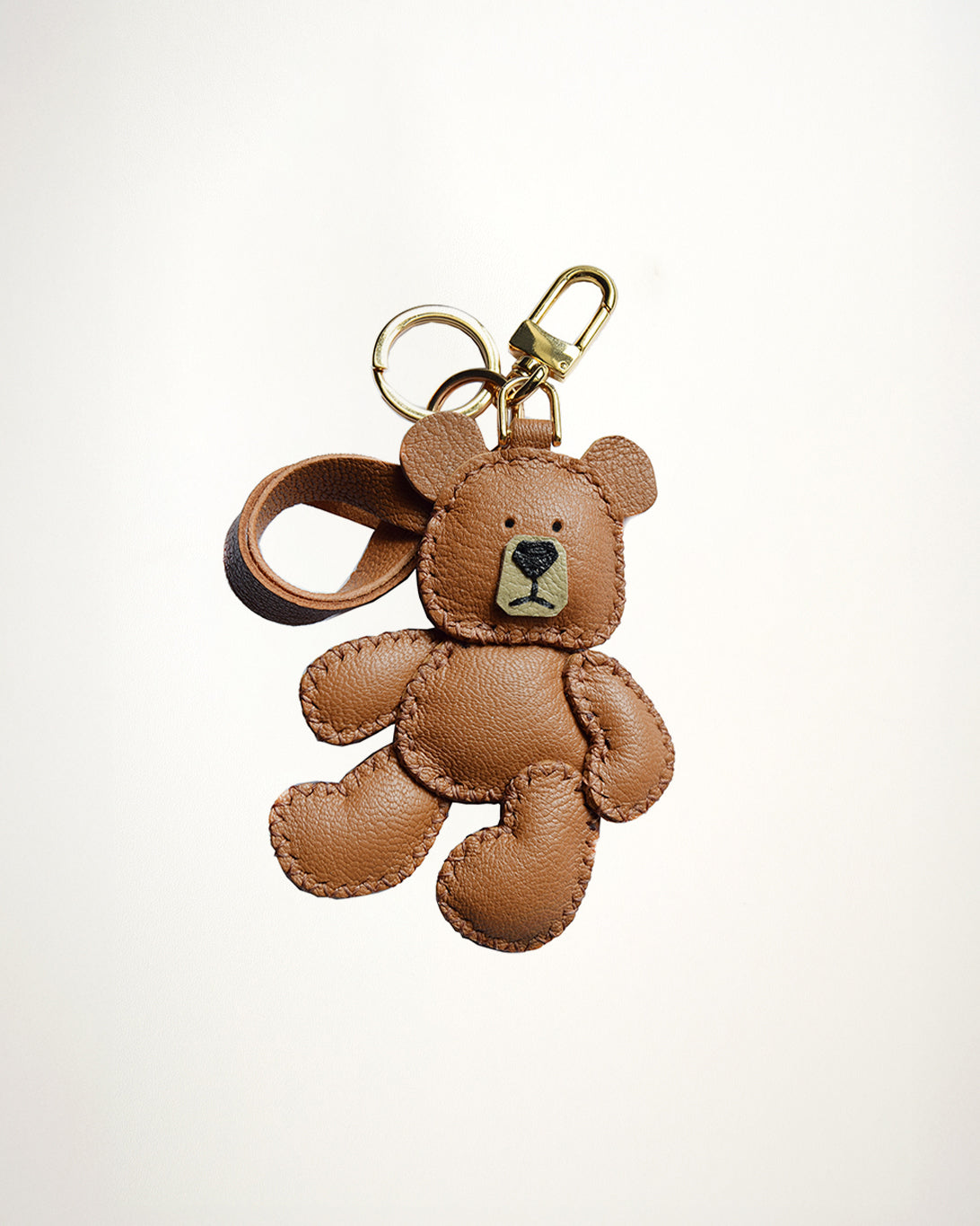 Mochi Manner handmade full-grain sheep leather teddy bear bag charm in brown with gold-plated hardware