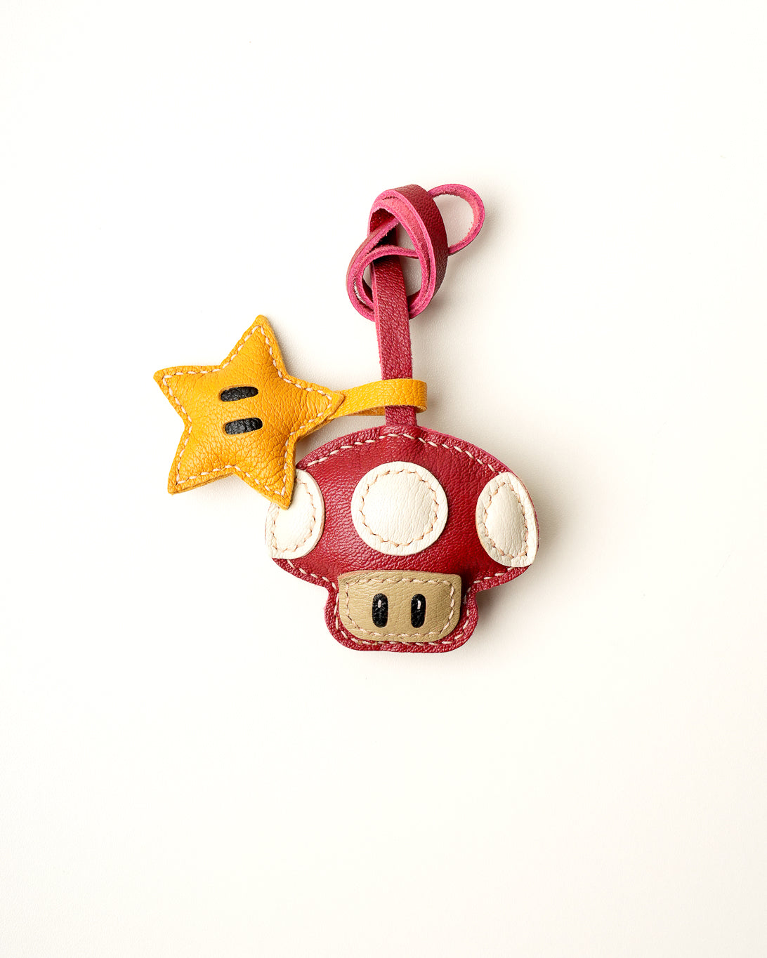 Mochi Manner handmade full-grain leather – sheep skin mushroom and star bag charm in red, yellow, and cream with gold-plated hardware